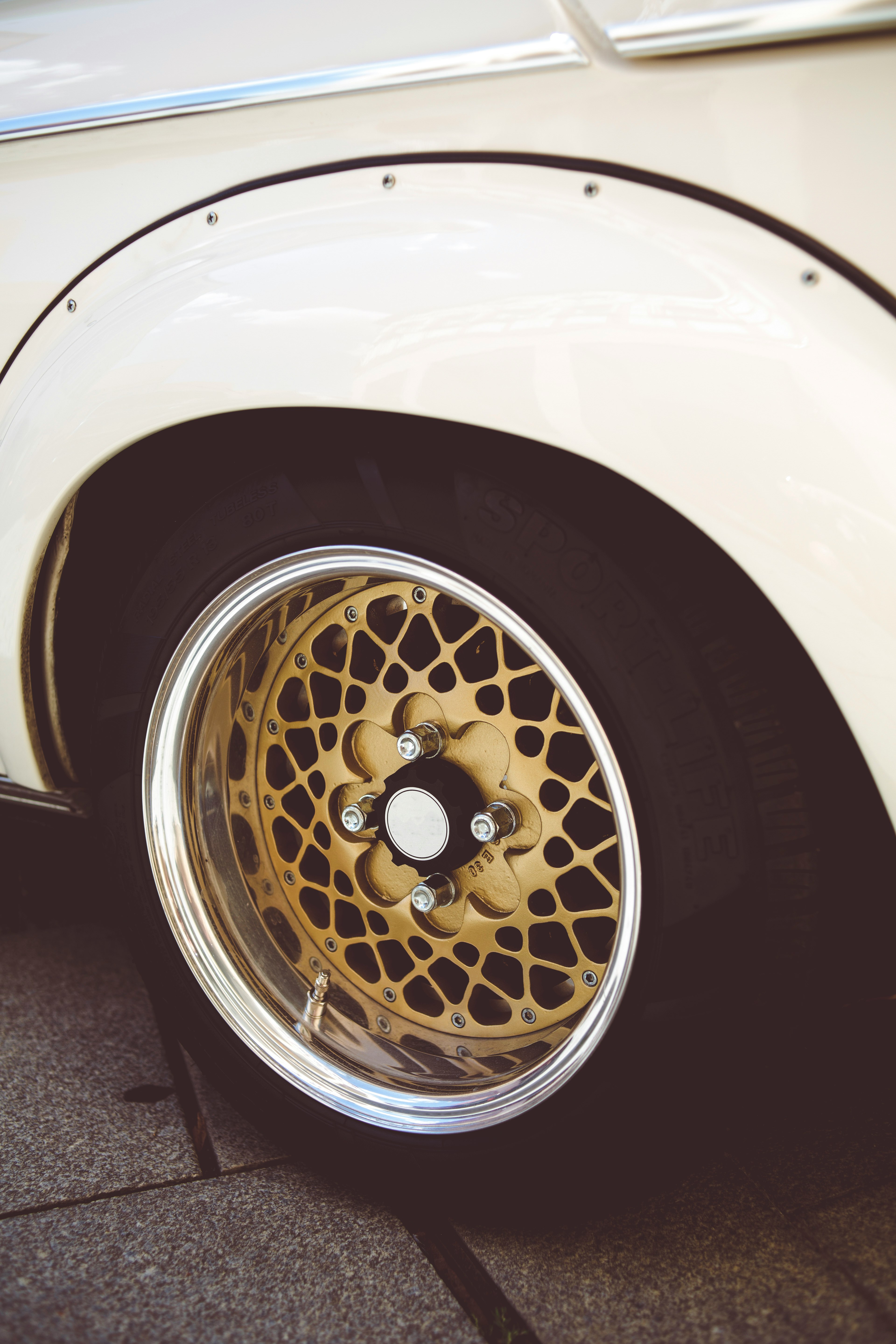 silver and gold car wheel with tire